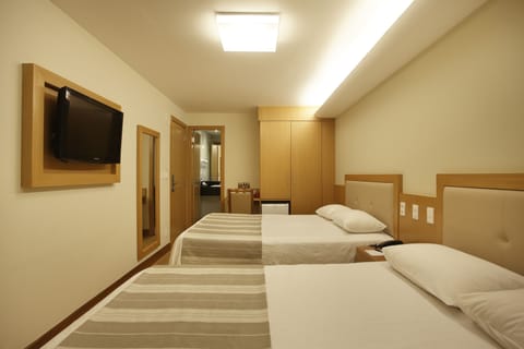 Deluxe Quadruple Room, 2 Double Beds | Minibar, in-room safe, laptop workspace, blackout drapes