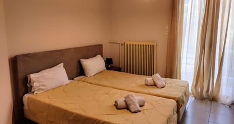 Economy Twin Room, 2 Twin Beds | Individually decorated, individually furnished, free WiFi, bed sheets