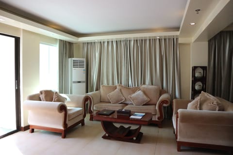 Angol Suites, King Bed | Living area | LCD TV, iPod dock