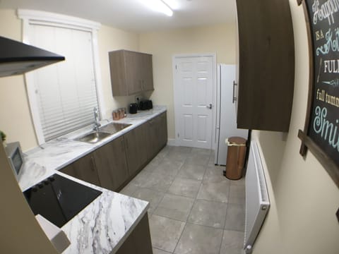 Premier Townhome | Private kitchen | Fridge, microwave, oven, stovetop