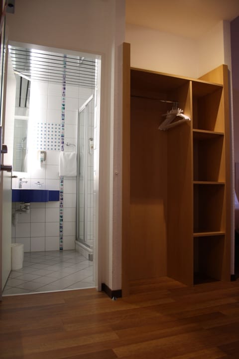 Shower, eco-friendly toiletries, hair dryer, towels