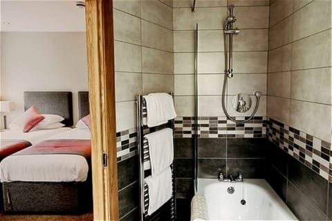 Twin Room | Bathroom | Hair dryer, towels, toilet paper