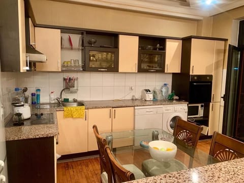 Family Apartment | Private kitchen | Fridge, microwave, oven, stovetop