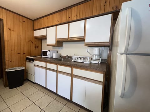 Wilmington Terrace Apartment 1 | Private kitchen | Full-size fridge, microwave, stovetop, coffee/tea maker