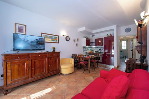 Family Apartment, 1 Bedroom (Casa Emma with Pool) | Living area | 21-inch flat-screen TV with cable channels, TV