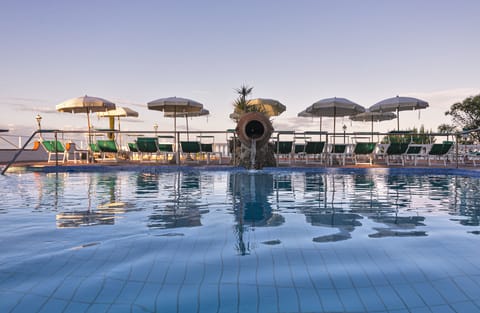 Indoor pool, seasonal outdoor pool, pool umbrellas, sun loungers