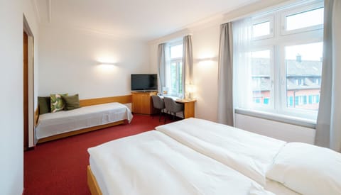 Comfort Triple Room | Individually furnished, desk, laptop workspace, blackout drapes