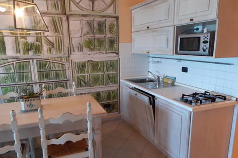 Family Apartment, 1 Bedroom, Sea Facing (Laigueglia Beach) | Private kitchen | Full-size fridge, microwave, oven, stovetop