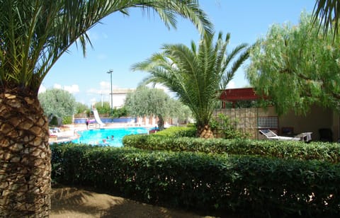 Apartment, 2 Bedrooms, Smoking, Patio | Pool | Outdoor pool, pool umbrellas