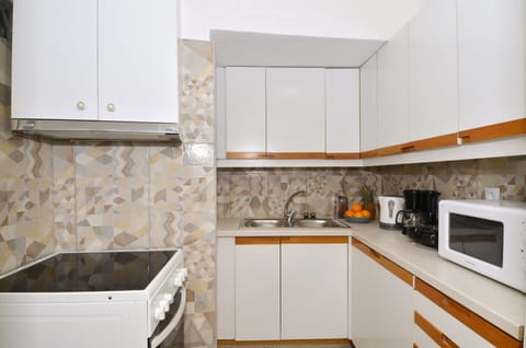 Apartment, 2 Bedrooms, Balcony | Private kitchen | Full-size fridge, microwave, stovetop, coffee/tea maker