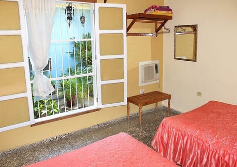 Family Quadruple Room | Minibar, in-room safe, individually decorated, individually furnished