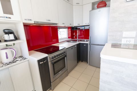 Apartment, 3 Bedrooms, Sea View | Private kitchen | Full-size fridge, microwave, stovetop, electric kettle