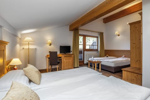 Classic Quadruple Room, 1 Bedroom, Non Smoking | Down comforters, minibar, in-room safe, desk