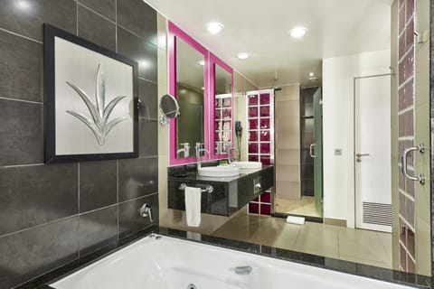 Separate tub and shower, eco-friendly toiletries, hair dryer, towels