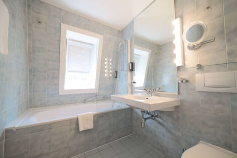 Suite, 1 Queen Bed | Bathroom | Combined shower/tub, eco-friendly toiletries, hair dryer, towels