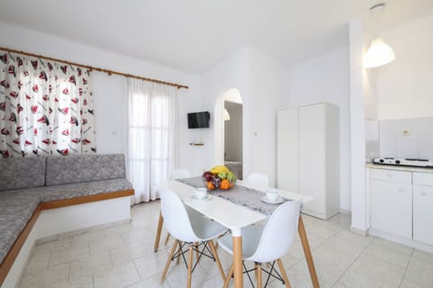 Standard Triple Room, Sea View | Living area | 32-inch TV with cable channels