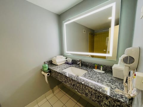 Room, 2 Double Beds | Bathroom | Combined shower/tub, free toiletries, hair dryer, towels