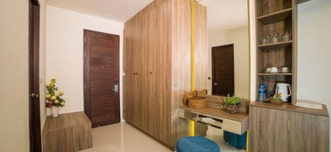 Deluxe Triple Room | In-room safe, desk, laptop workspace, blackout drapes