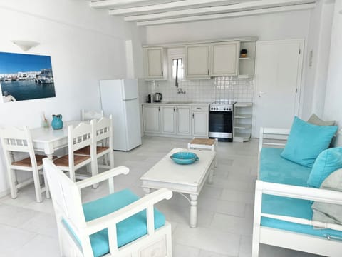 Apartment, 2 Bedrooms, Partial Sea View | Living area | 30-cm flat-screen TV with satellite channels, TV