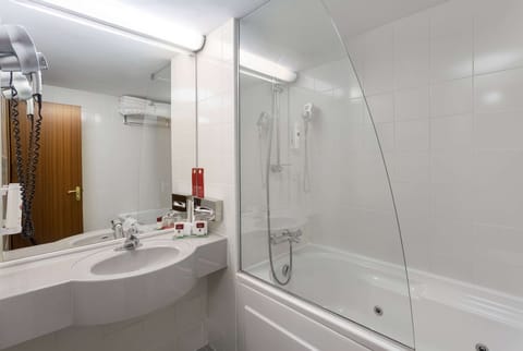 Suite, 1 King Bed, Non Smoking | Bathroom | Bathtub, free toiletries, hair dryer, bathrobes