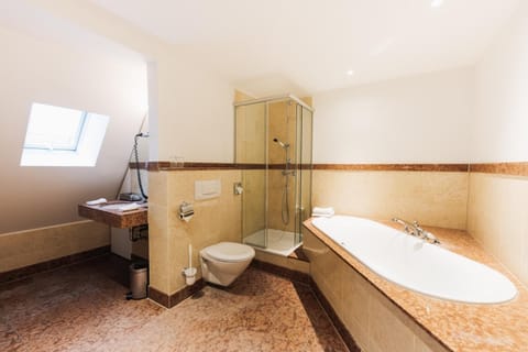 Family Suite, City View | Bathroom | Designer toiletries, hair dryer, towels