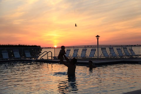 Outdoor pool, a heated pool, pool umbrellas, sun loungers