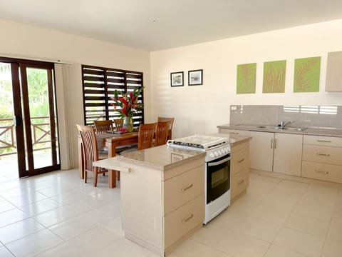 Pool View Two-Bedroom Apartment | Private kitchen | Full-size fridge, coffee/tea maker, electric kettle, toaster