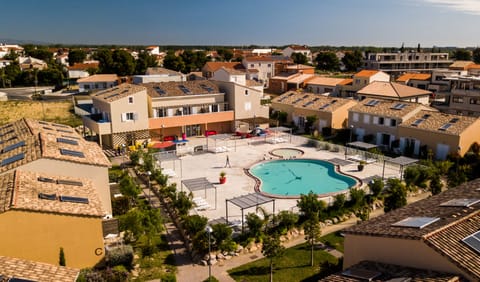 Seasonal outdoor pool, open 10:00 AM to 8:00 PM, pool umbrellas