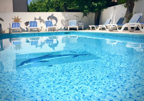 Seasonal outdoor pool, open 9:30 AM to 7:00 PM, sun loungers