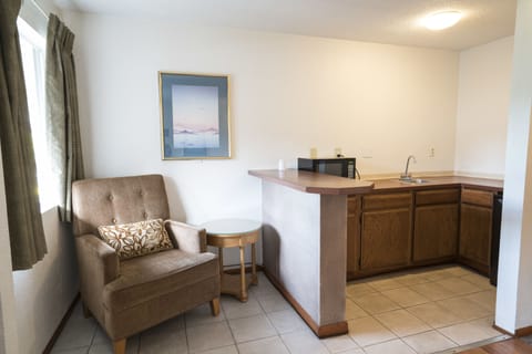 One Queen Bed with 7 Days Parking | Private kitchenette | Fridge