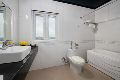 Deluxe Triple Room | Bathroom | Hydromassage showerhead, designer toiletries, hair dryer, slippers