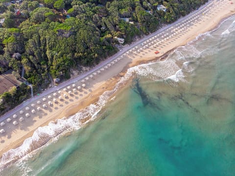 Private beach, white sand, sun loungers, beach umbrellas