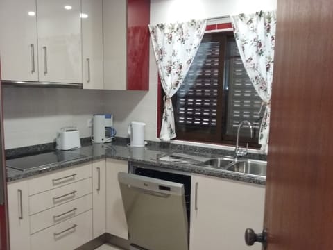 Family Apartment, 3 Bedrooms | Private kitchen | Full-size fridge, microwave, stovetop, coffee/tea maker