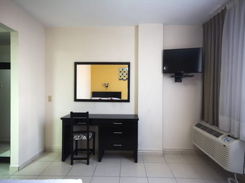 Standard Room, 2 Double Beds | Living area | 32-inch TV with satellite channels