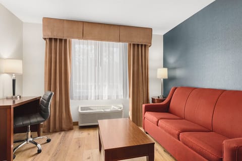 Premium bedding, desk, laptop workspace, blackout drapes