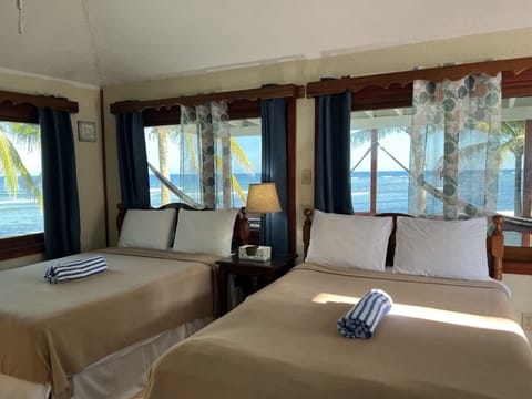 Deluxe Cabin, Multiple Beds, Ocean View, Beachfront | Premium bedding, pillowtop beds, individually decorated