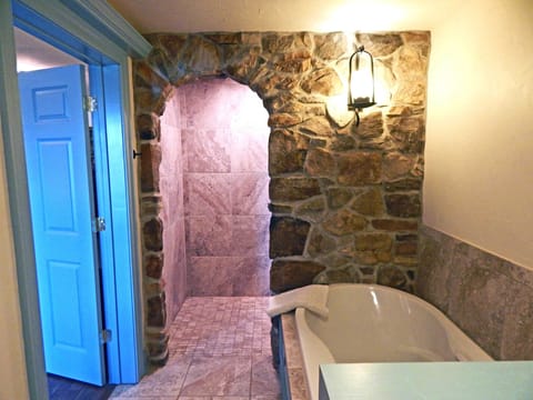 Houghtelin's Hideaway Room with 1 King, Fireplace and Patio | Bathroom | Designer toiletries, hair dryer, towels