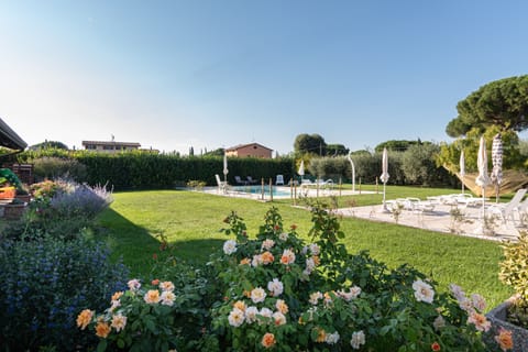 Seasonal outdoor pool, open 9:00 AM to 8:30 PM, pool umbrellas