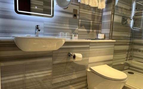 Triple Room | Bathroom | Shower, hair dryer, bathrobes, towels