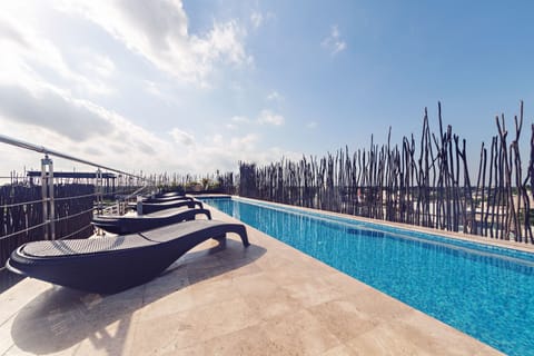 Outdoor pool, open 8:00 AM to 9:00 PM, pool umbrellas, sun loungers