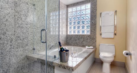 Suite, 1 King Bed, Non Smoking, Jetted Tub | Bathroom | Combined shower/tub, free toiletries, hair dryer, towels