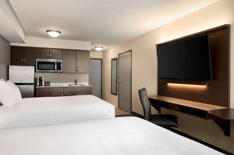 Suite, 2 Queen Beds, Non Smoking | Desk, laptop workspace, blackout drapes, iron/ironing board