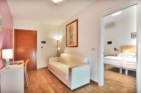 Family Room | Down comforters, minibar, in-room safe, desk