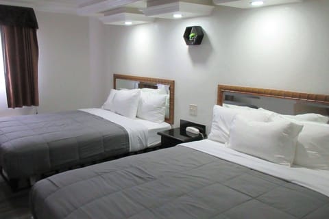 Standard Room, 2 Queen Beds, Non Smoking | Free WiFi, bed sheets