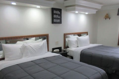 Standard Room, 2 Queen Beds, Non Smoking | Free WiFi, bed sheets