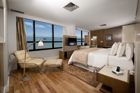 Executive Suite | Minibar, in-room safe, individually decorated, individually furnished