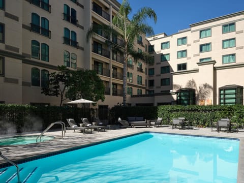 Outdoor pool, pool umbrellas, sun loungers