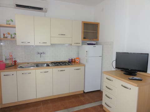 Apartment, 2 Bedrooms (A40019) | Private kitchen | Full-size fridge, stovetop, cookware/dishes/utensils