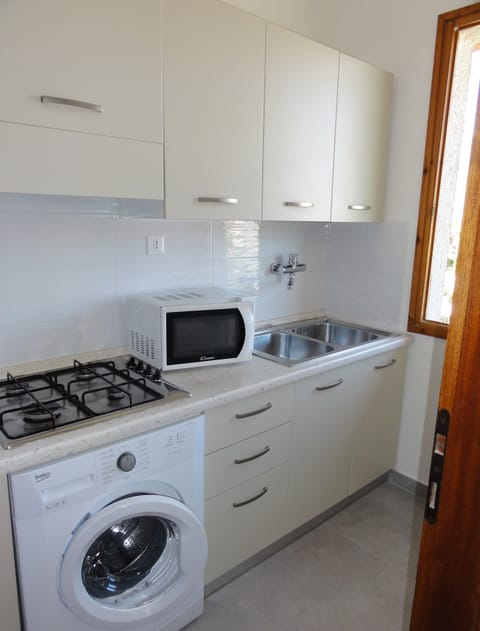 Apartment, 2 Bedrooms (B10064) | Private kitchenette | Full-size fridge, microwave, stovetop, cookware/dishes/utensils