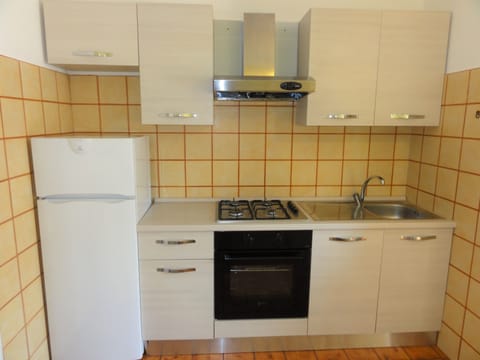 Apartment, 1 Bedroom (Via Lira 62 C40112) | Private kitchen | Full-size fridge, microwave, cookware/dishes/utensils